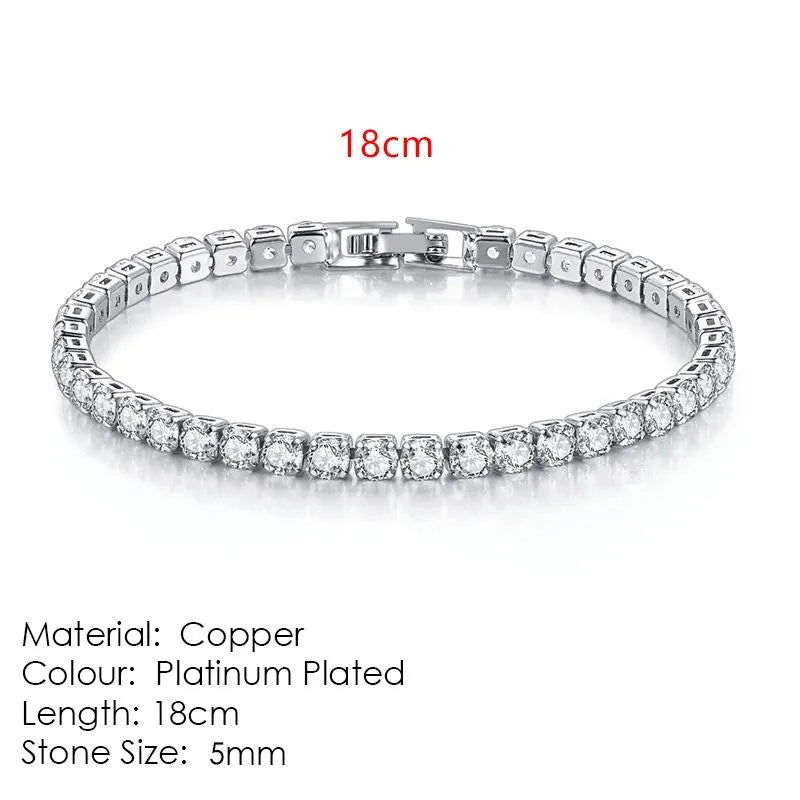 Silver tennis bracelet laid flat on a white background, labeled 18cm length, Material: Copper, Colour: Platinum Plated, Stone Size: 5mm.