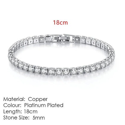 Silver tennis bracelet laid flat on a white background, labeled 18cm length, Material: Copper, Colour: Platinum Plated, Stone Size: 5mm.