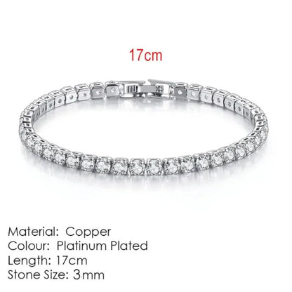 Silver tennis bracelet laid flat on a white background, labeled 17cm length, Material: Copper, Colour: Platinum Plated, Stone Size: 3mm.