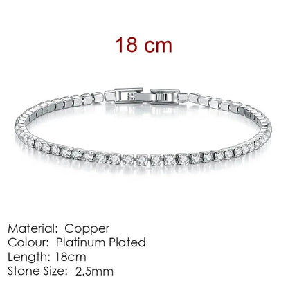 Silver tennis bracelet laid flat on a white background, labeled 18cm length, Material: Copper, Colour: Platinum Plated, Stone Size: 2.5mm.