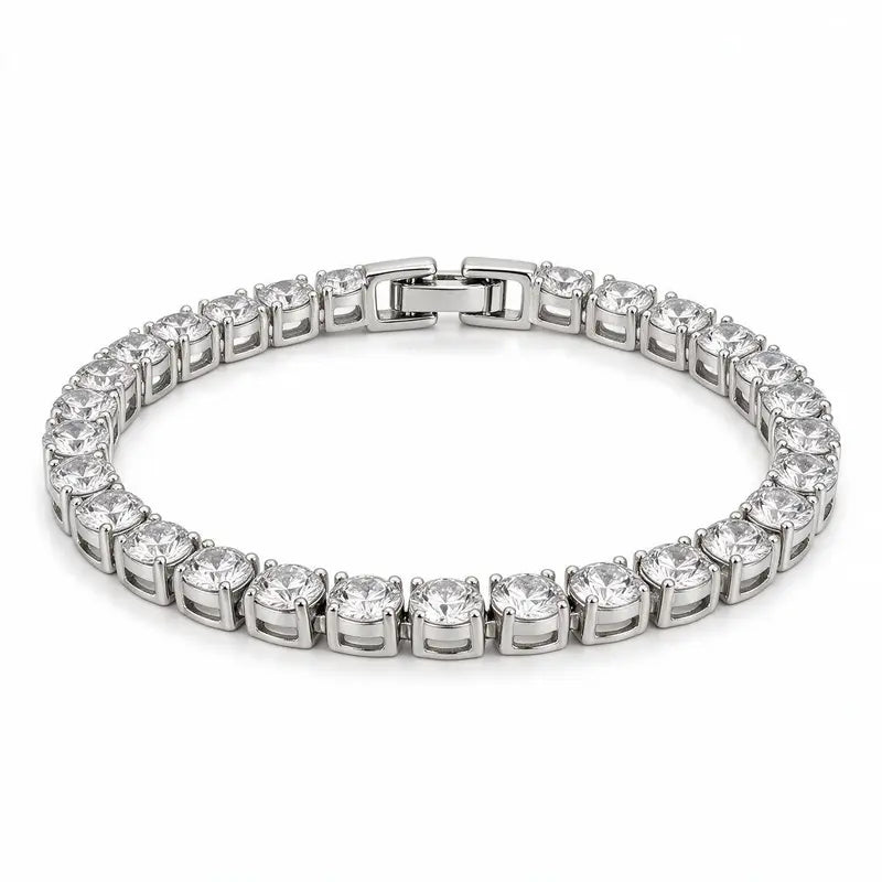 Silver tennis bracelet with round cubic zirconia stones, on a plain white background.