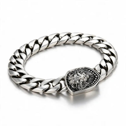 Regal Lion Cuban Bracelet, silver Cuban chain with lion-head clasp, white background
