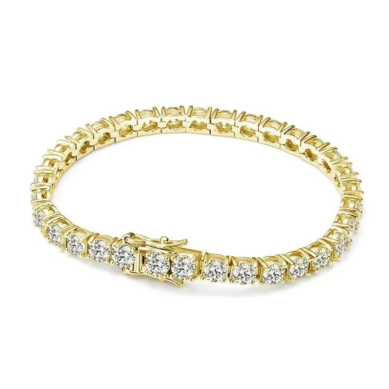 Gold-tone tennis bracelet with moissanite stones laid flat in an oval on a plain white background.
