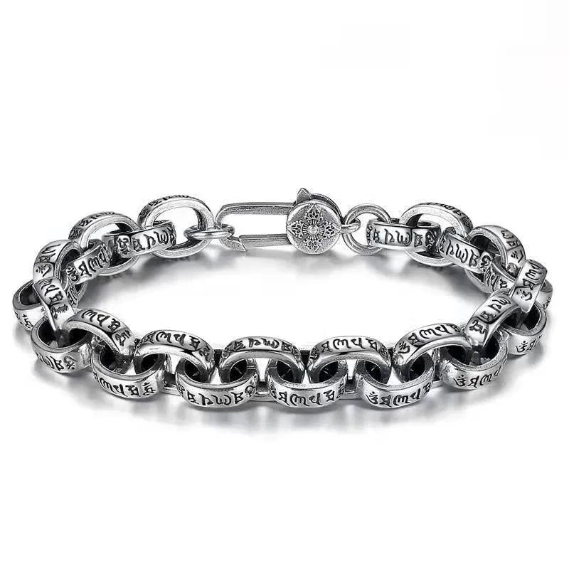 Silver oval-link chain bracelet with engraved Tibetan mantra script on each link, laid in an oval on a plain white background, with a round decorative clasp.