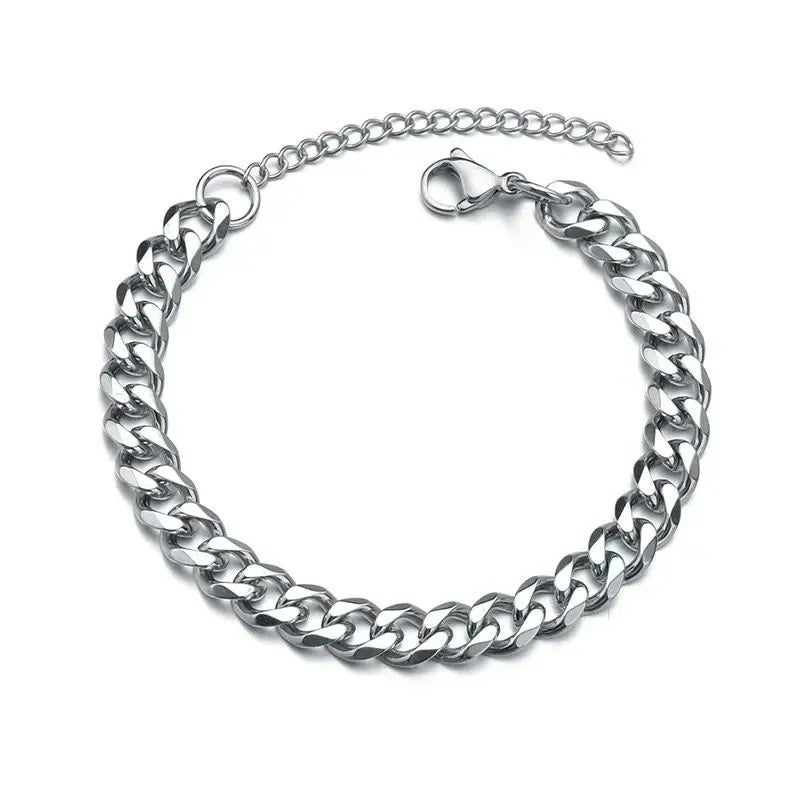 Silver Cuban chain bracelet laid in a circle on a plain white background, with the lobster clasp and extension chain visible.