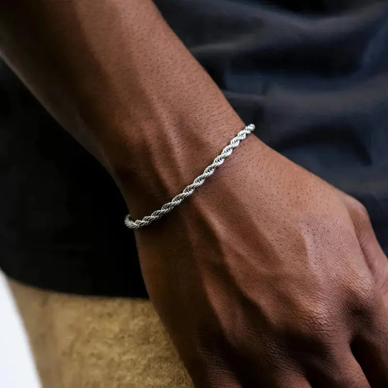 Silver stainless steel twisted rope chain bracelet worn on wrist