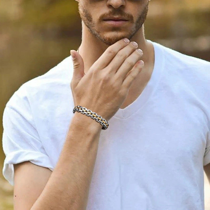 Silver and gold two-tone watch-link bracelet worn on wrist