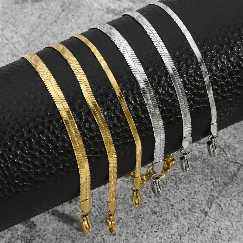 Snake chain bracelets in gold and silver, multiple widths