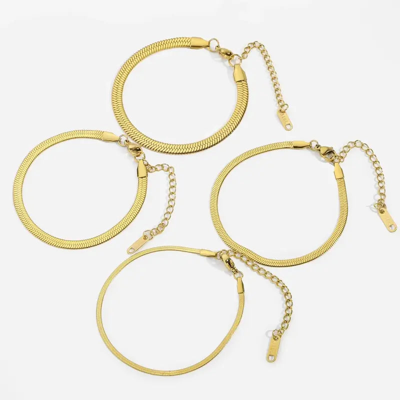 Gold stainless steel snake chain bracelets flat lay