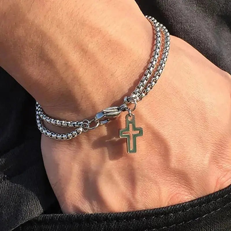 Stainless steel double chain cross bracelet worn on wrist