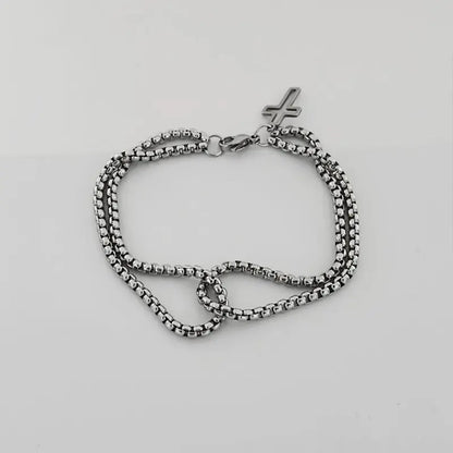 Stainless steel double chain bracelet with hollow cross charm and lobster clasp