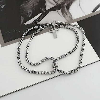 Stainless steel double box chain bracelet with cross charm flat lay