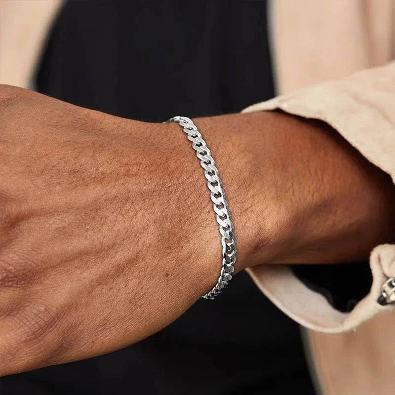 Silver stainless steel curb chain bracelet worn on wrist