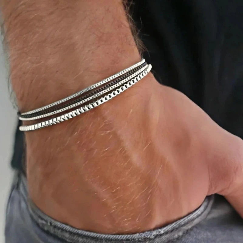 Layered stainless steel box chain bracelets worn on wrist