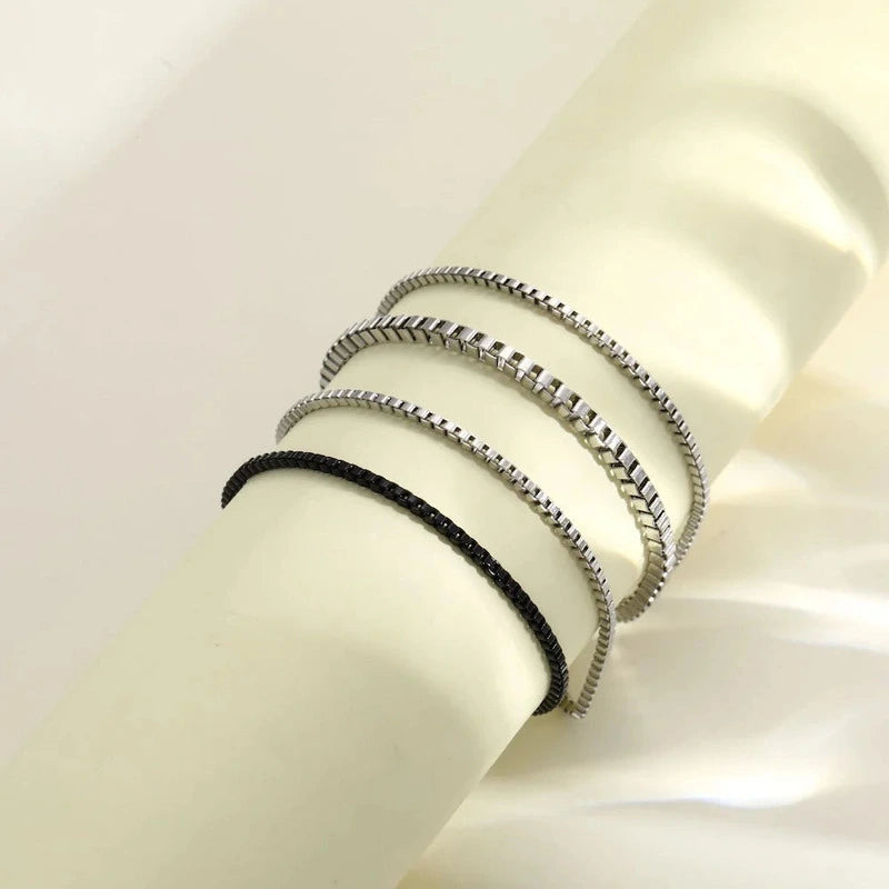 Multi-layer stainless steel box chain bracelet set close-up on wrist