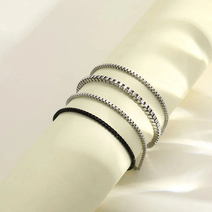 Multi-layer stainless steel box chain bracelet set close-up on wrist
