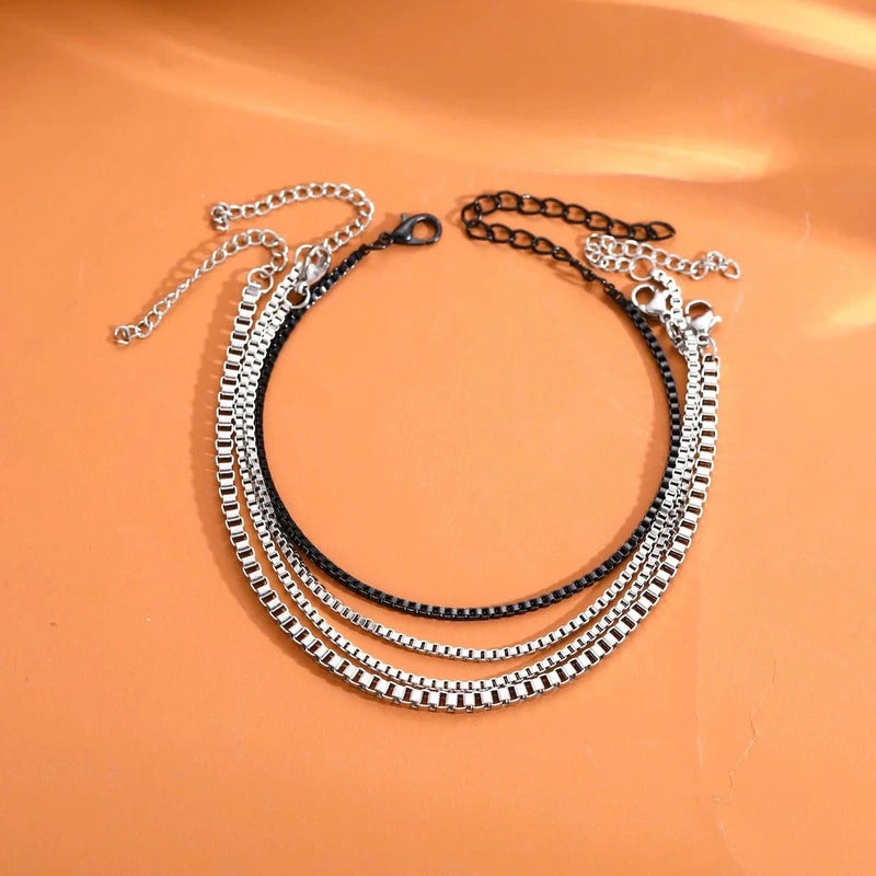 Set of 4 stainless steel box chain bracelets, 3 silver and 1 black, stacked layered style