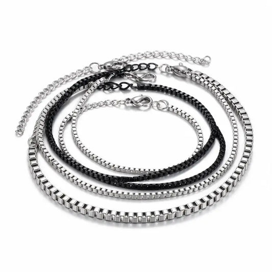 Set of 4 stainless steel box chain bracelets, 3 silver and 1 black, product photo on white background