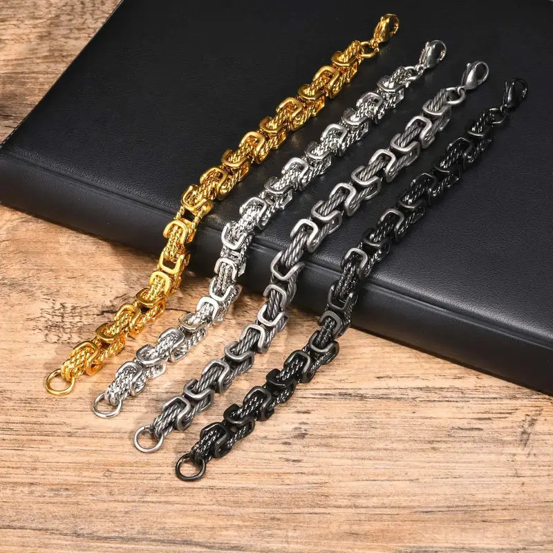 Chunky byzantine link bracelets in gold, silver, grey antique, and black stainless steel