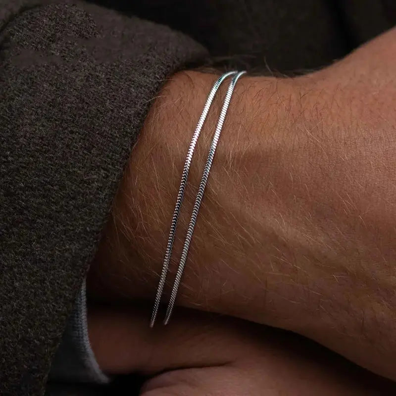 Silver stainless steel snake chain bracelets worn on wrist